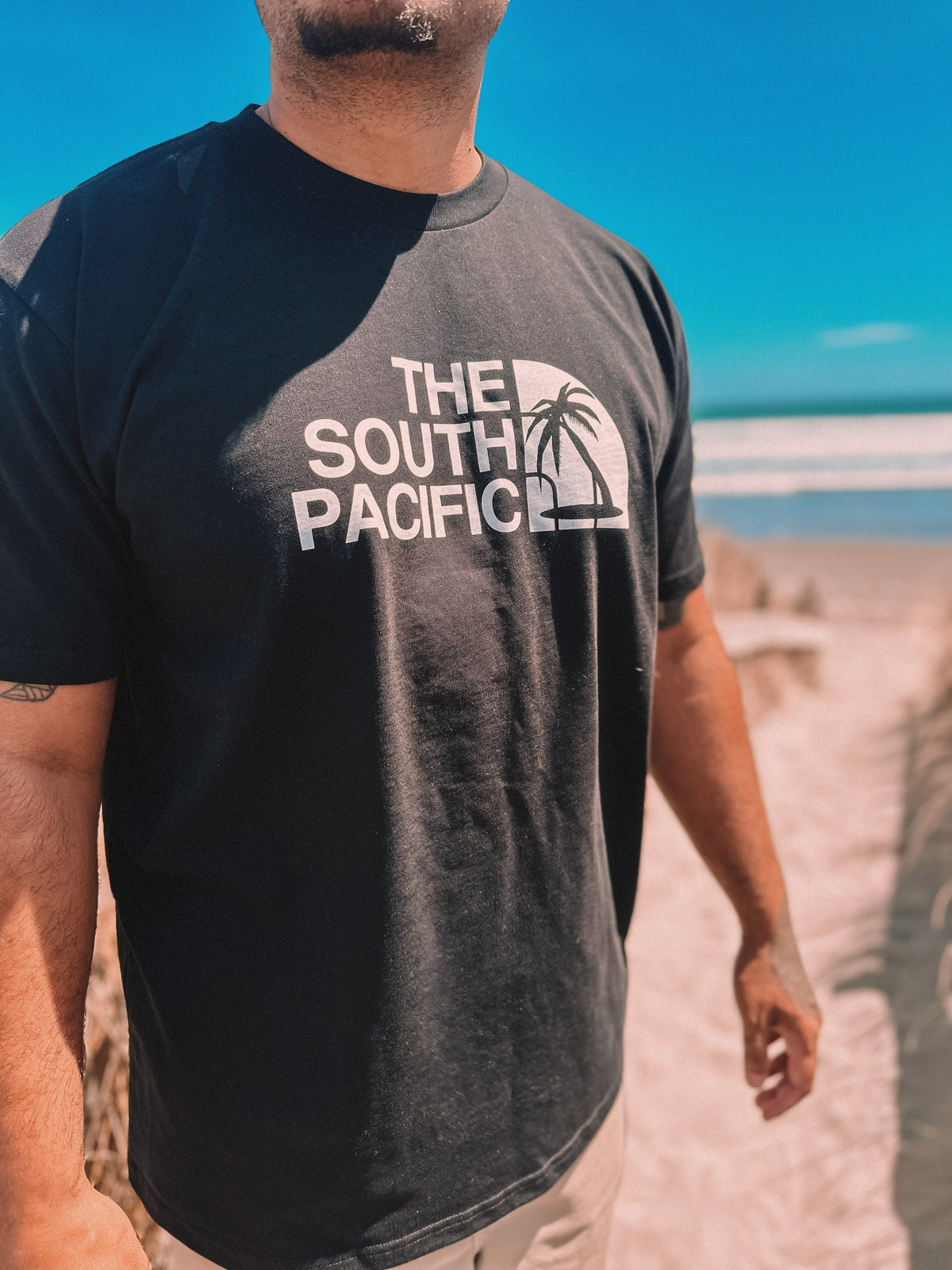 "The south pacific"  black tee