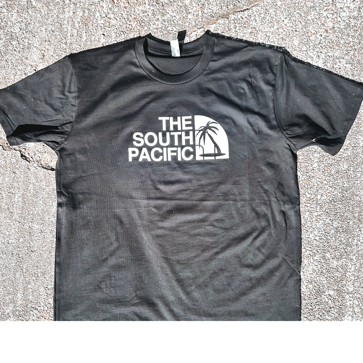 "The south pacific"  black tee